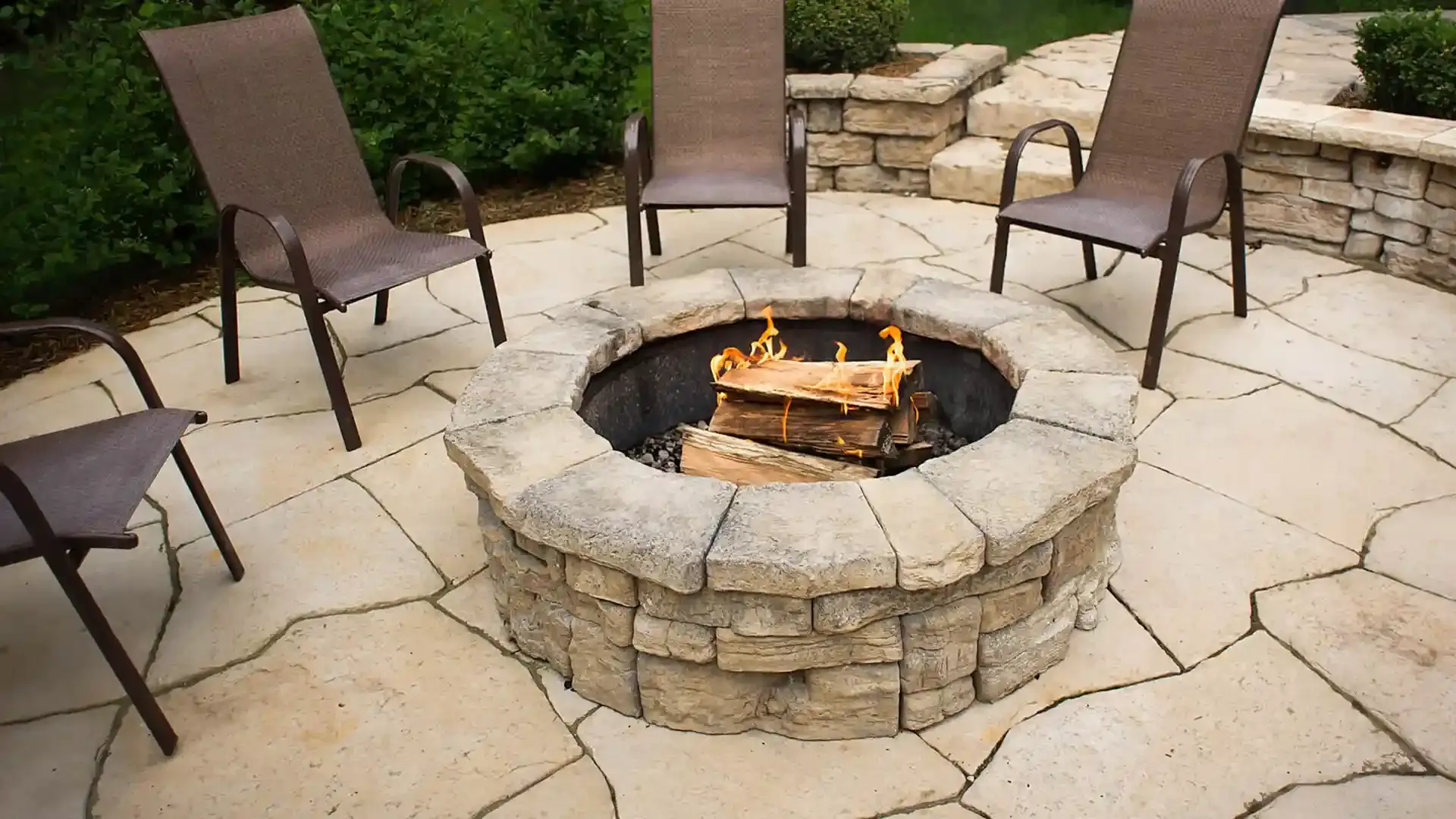 Circular paver fire pit with outdoor seating in a Florida backyard Circular paver fire pit with outdoor seating in a Florida backyard