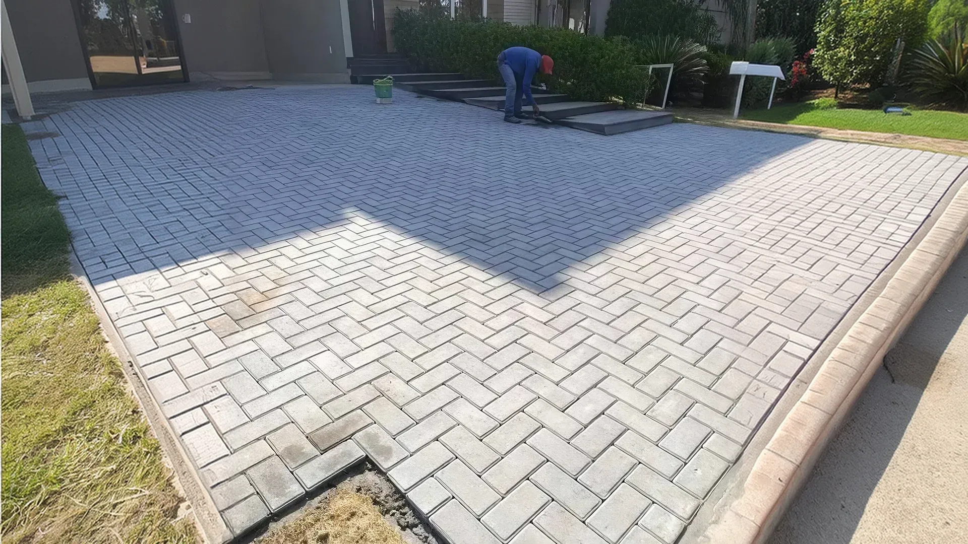 Homeowner reviewing HOA approval documents for a paver installation project Homeowner reviewing HOA approval documents for a paver installation project