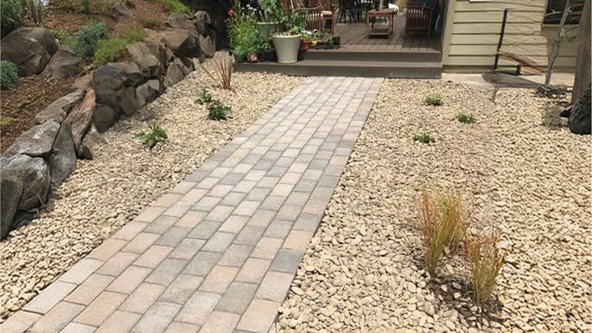 Wide paver walkway connecting the driveway to the front entrance of a Florida home Wide paver walkway connecting the driveway to the front entrance of a Florida home