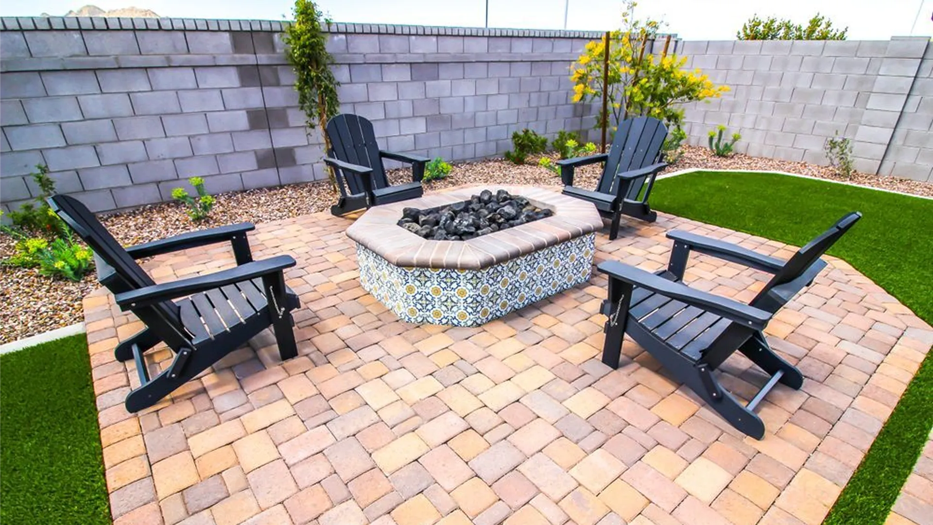 Family holiday gathering on a paver patio in the evening