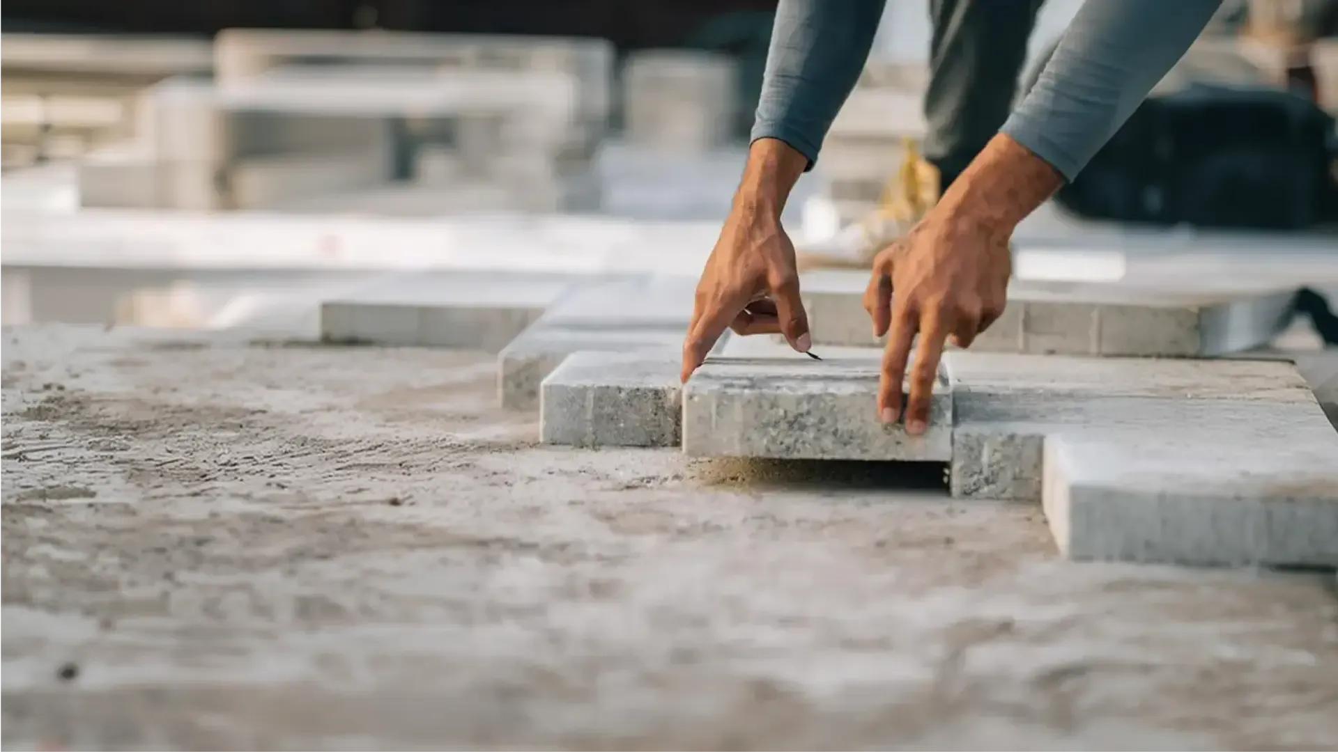 AllBrick Pavers crew placing a paver, book a free consultation in Central Florida