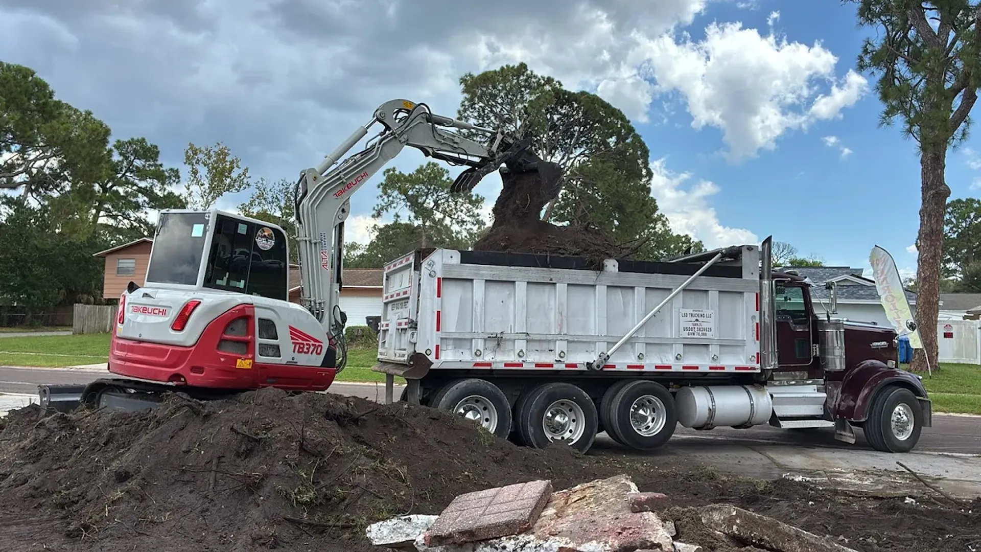 precision driveway crowning and road base compaction