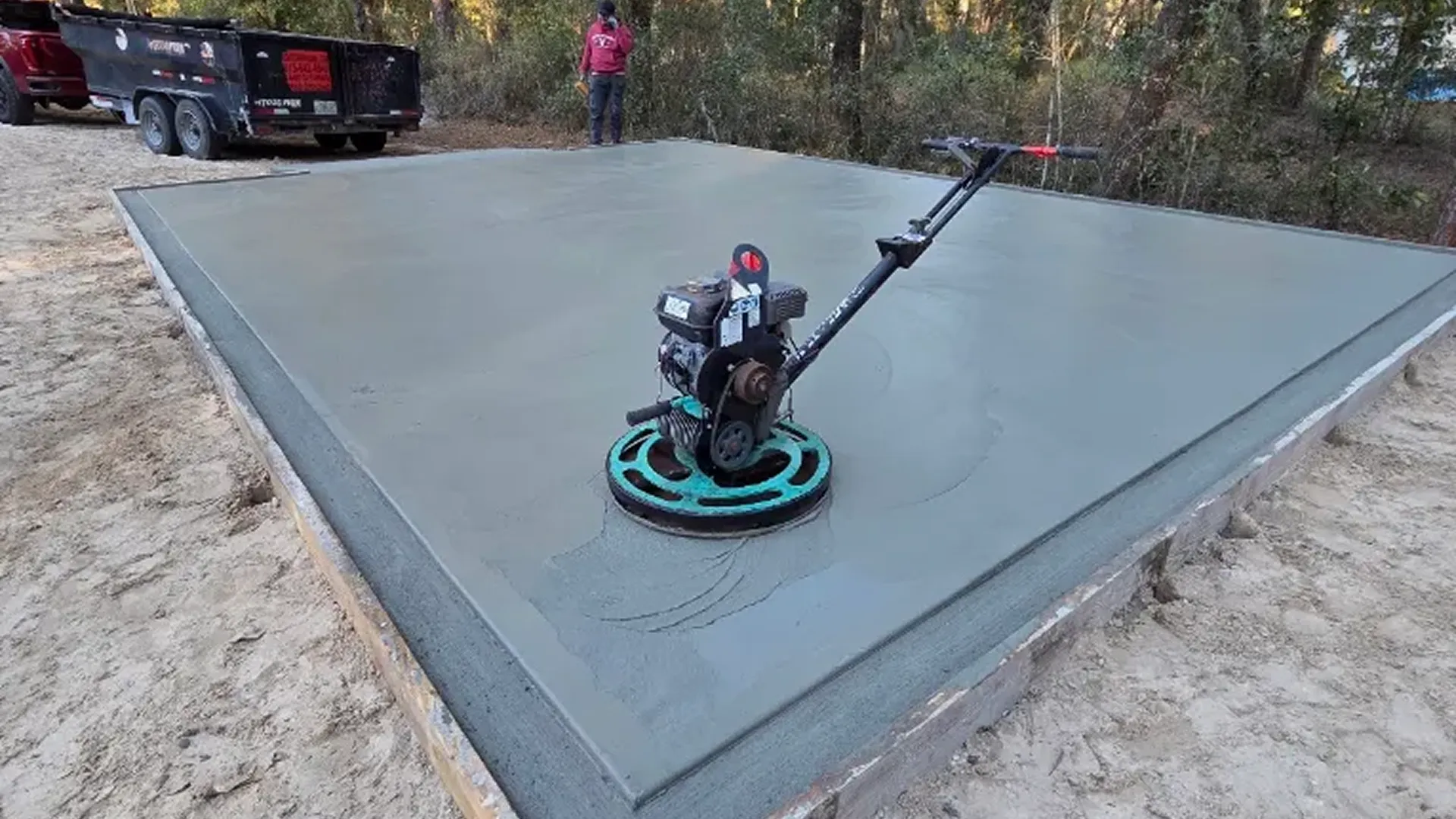 heavy vibratory roller compacting barndominium building pad