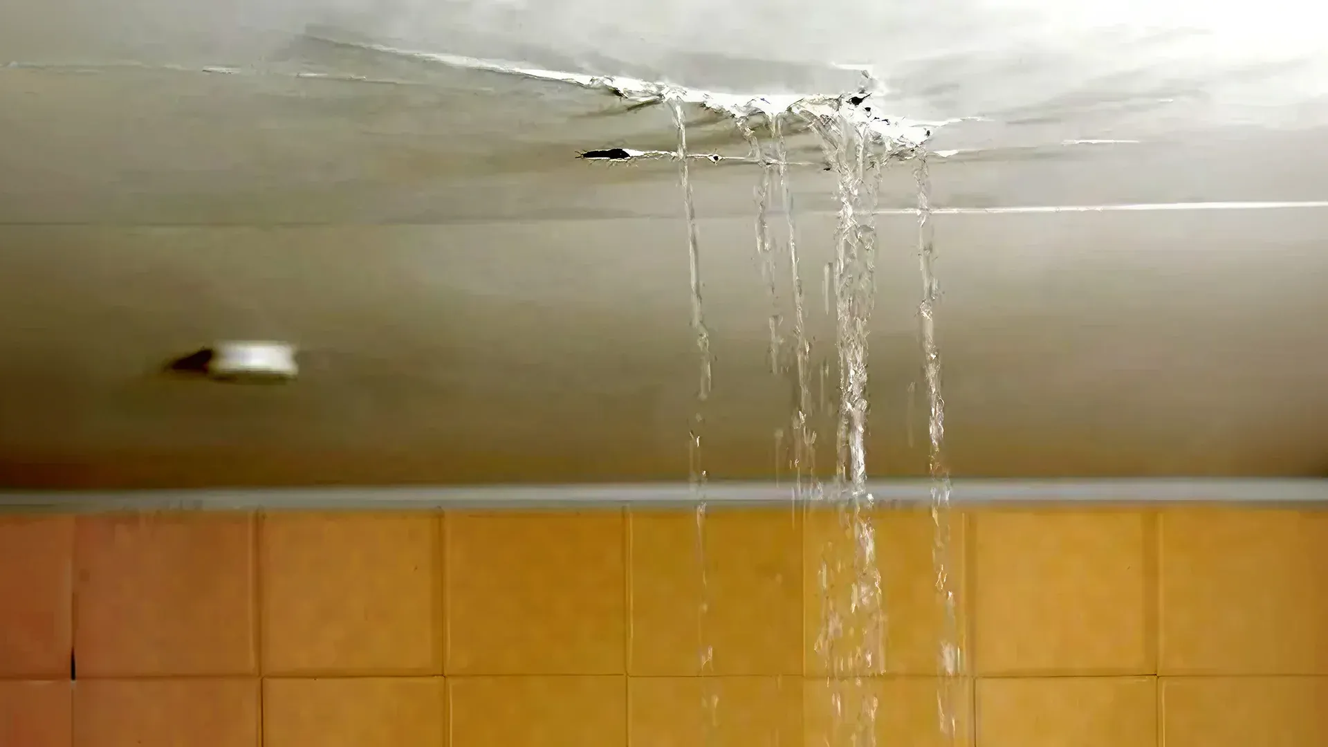 Emergency repairs to a roof leak are underway inside a house in Odessa Emergency repairs to a roof leak are underway inside a house in Odessa