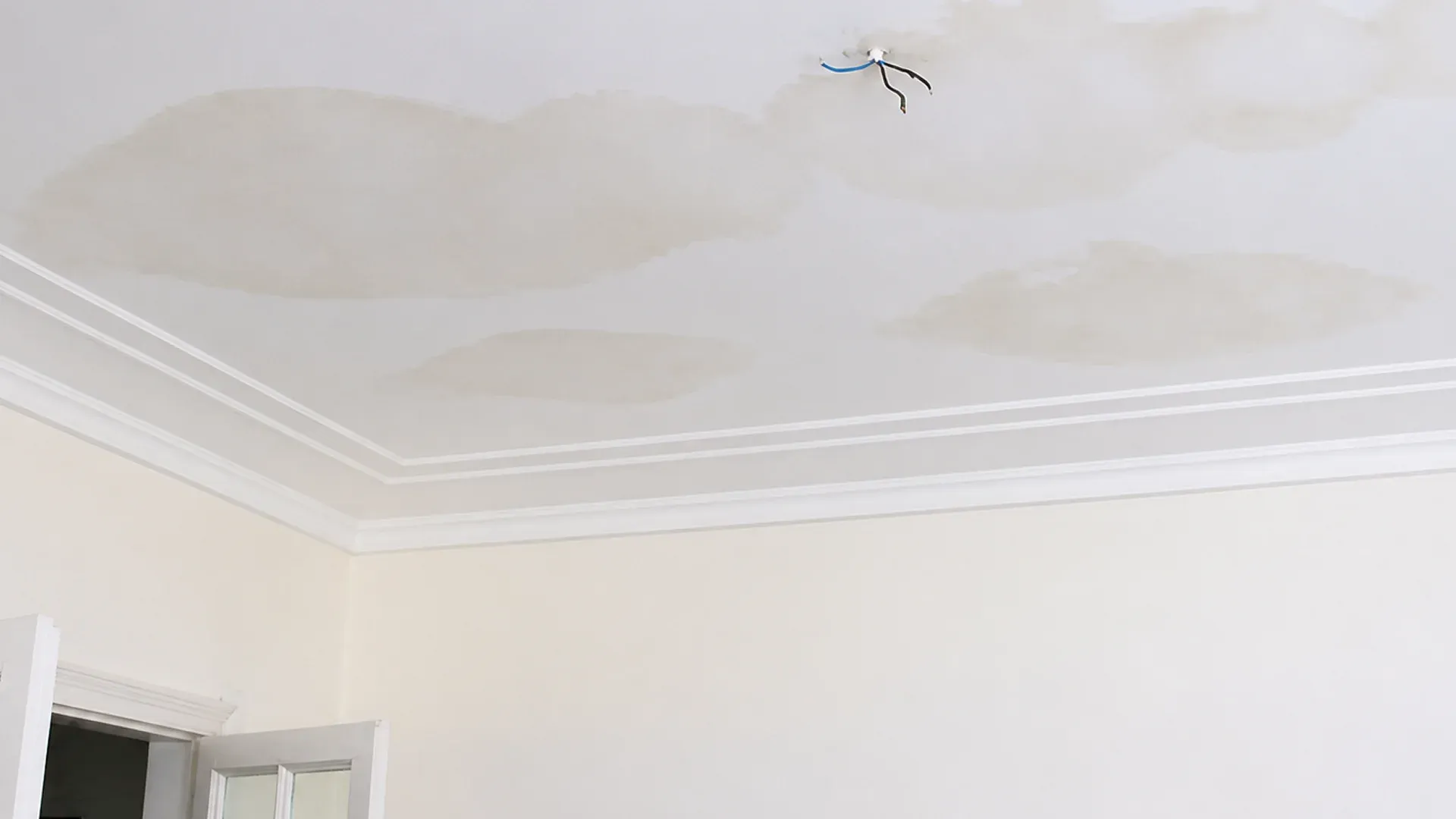 a stain on the ceiling indicating a leak in the roof a stain on the ceiling indicating a leak in the roof