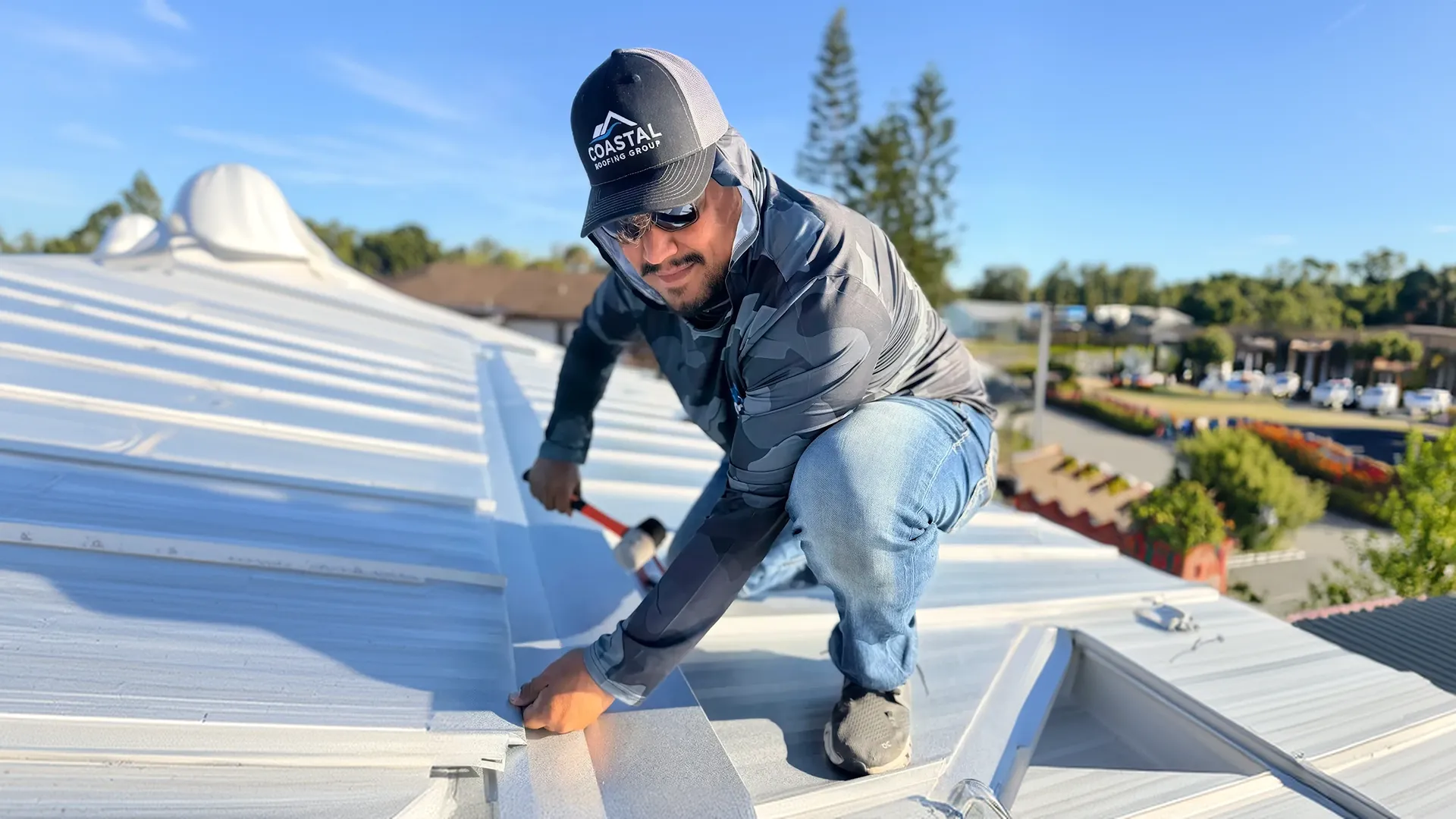 Coastal Roofing Group professional installing a metal roof in Charlotte County, FL