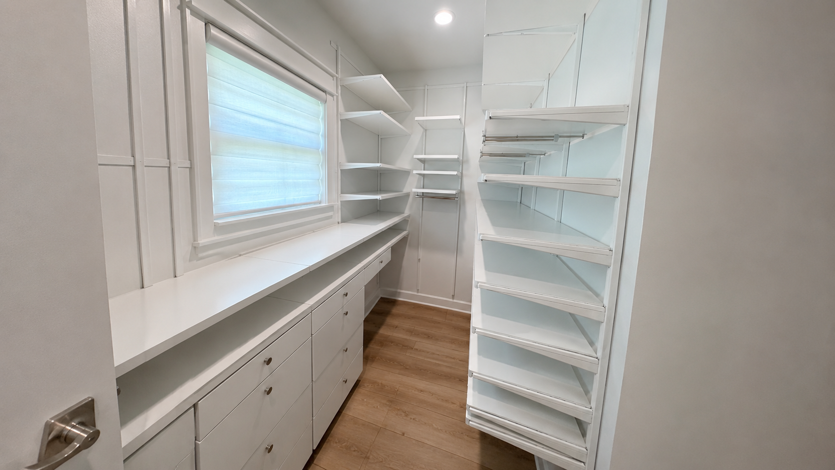 Move in cleaning service deep cleaning a kitchen countertop and cabinets in a Tampa Bay home
