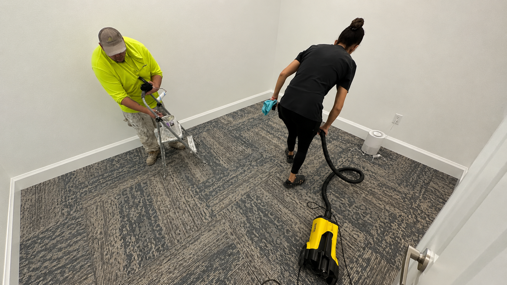 Professional post construction cleaner using HEPA vacuum to remove drywall dust in a St. Petersburg home Professional post construction cleaner using HEPA vacuum to remove drywall dust in a St. Petersburg home