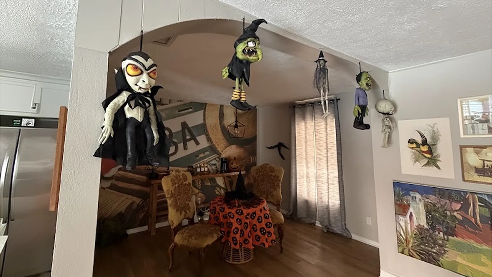 Clean, Halloween decorated living room with hanging skeleton decor ready for guests in St. Petersburg