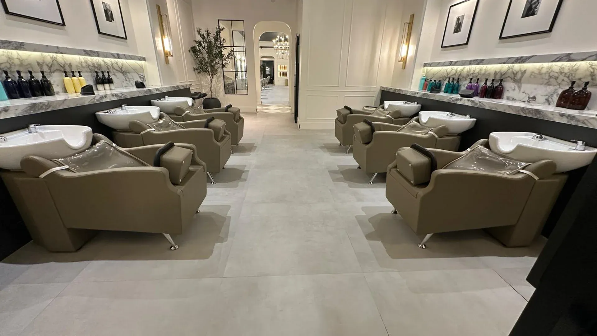 Commercial space with clean marble counters, chairs and polished floor, the kind of area an office cleaning service maintains