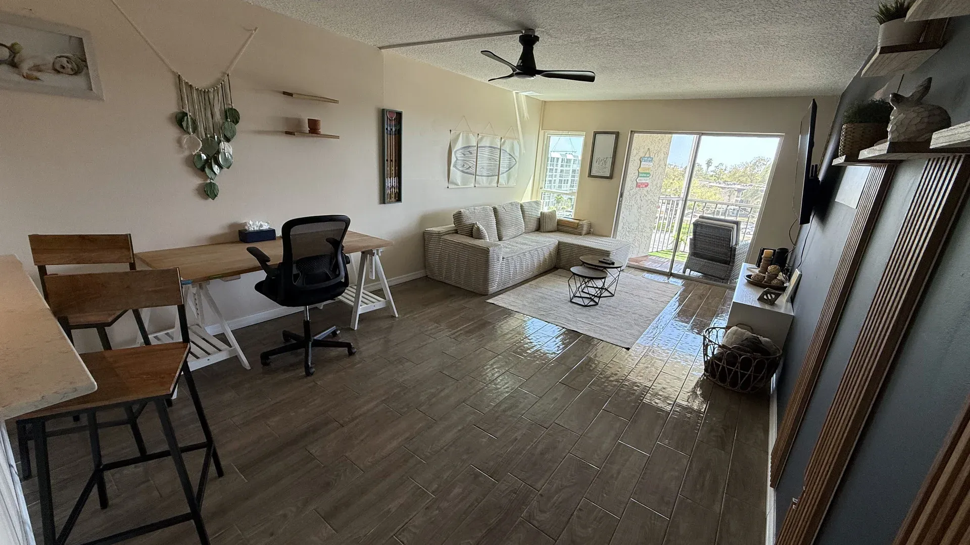 Open work area with a desk, office chair and glossy floor, a shared space kept clean by an office cleaning service