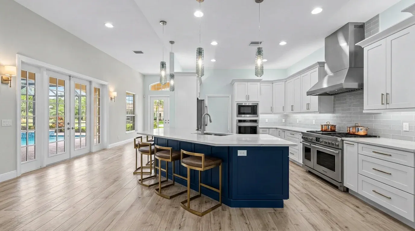 Open concept modern luxury kitchen remodel with waterfall island in Southwest Florida